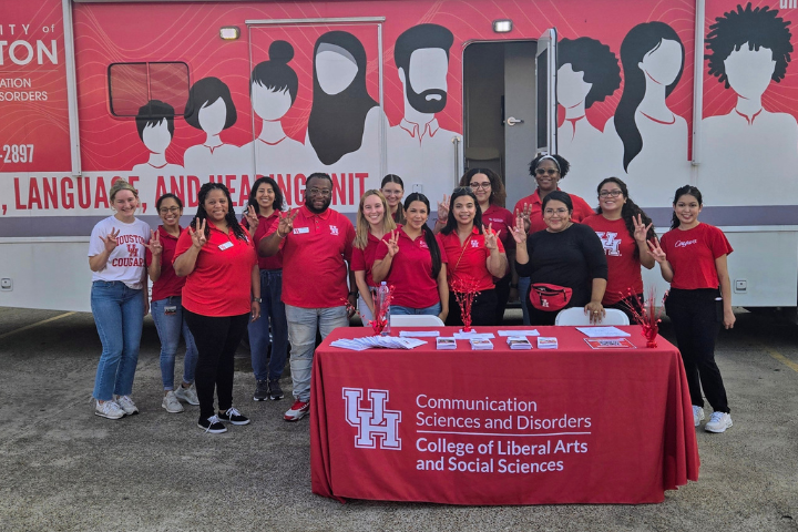 Communication Sciences and Disorders Team and Office of Government and Community Relations team standing in front of Speech, Language, and Hearing Unit Truck