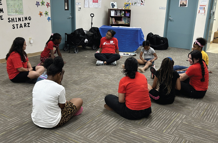 Instructor with student sitting in a circle