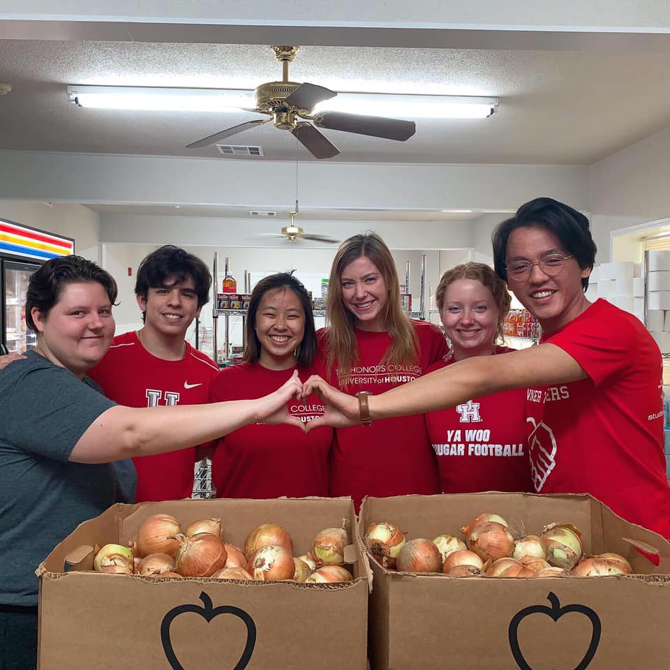 Sara-Grace posing for photo with fellow students at food pantry service site.